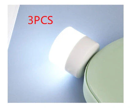 Compact USB LED night light with soft glow for reading and sleep