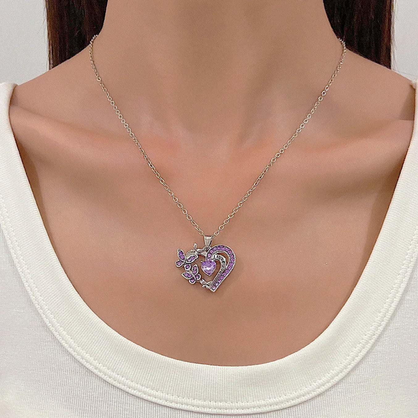 Butterfly Love Necklace with rhinestones and hollow heart-shaped pendant in white, purple, or pink