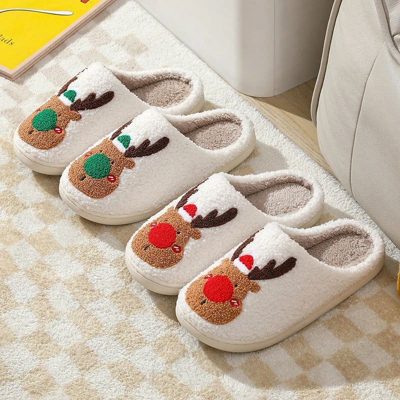 Cozy elk-themed slip-on house slippers in festive red and green colors with plush, soft materials for comfortable holiday relaxation