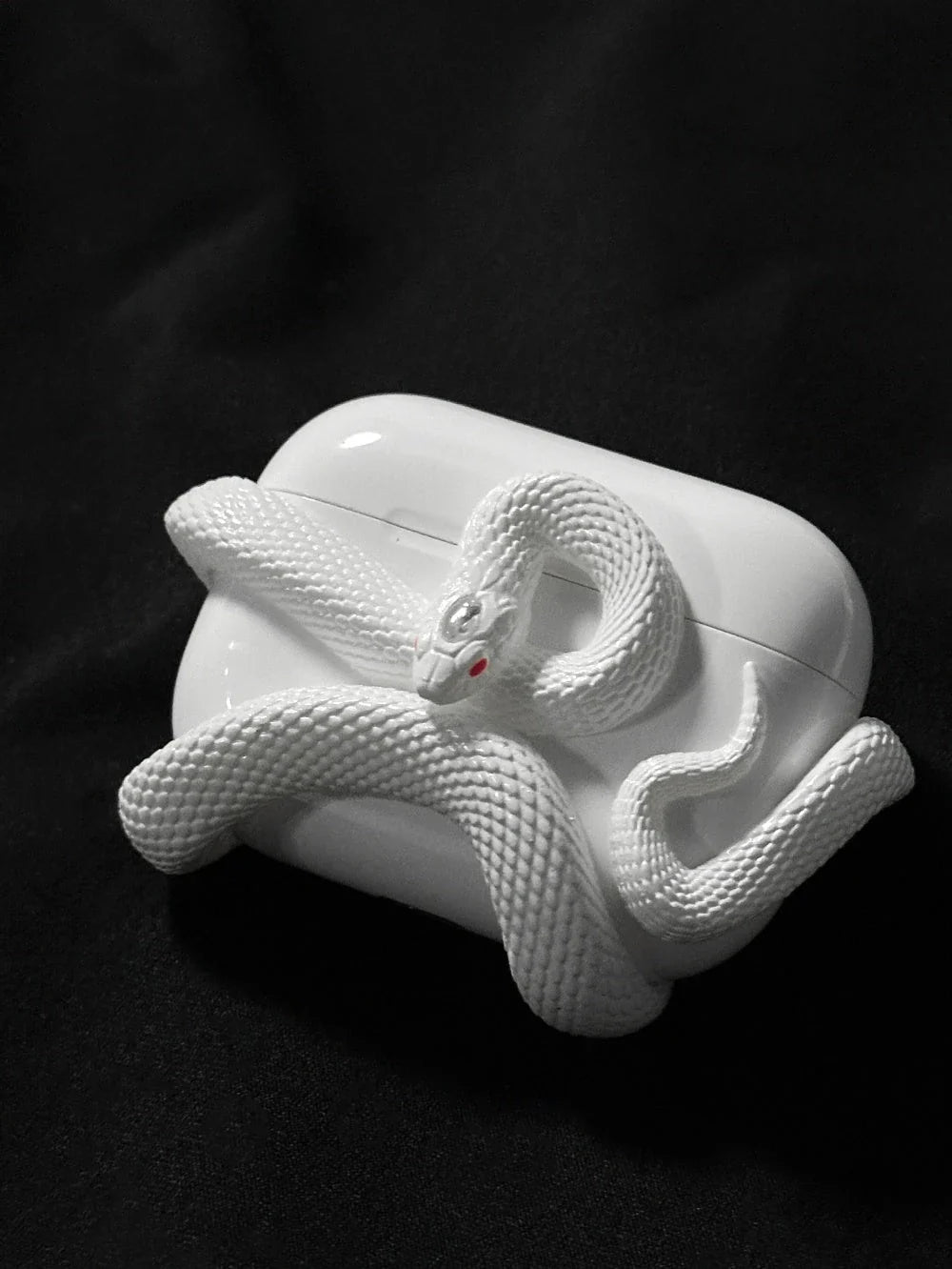 Spooky AirPods Pro case with creepy snake design, offers superior protection for wireless earphones