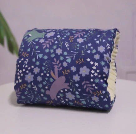 Adjustable baby nursing arm pillow in various colors and patterns, including dark blue, gray, pink, and more. Features soft, breathable cotton fabric and an ergonomic design to support breastfeeding mothers.