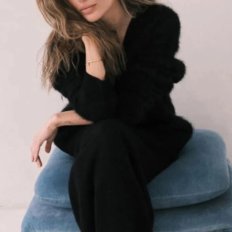 A stylish loose knit cardigan in a variety of colors, featuring a v-neck design and single-breasted closure for a flattering, relaxed fit.