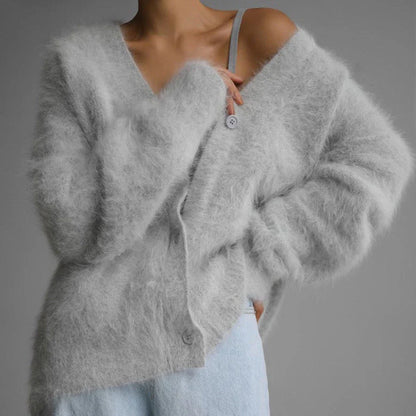 A stylish loose knit cardigan in a variety of colors, featuring a v-neck design and single-breasted closure for a flattering, relaxed fit.