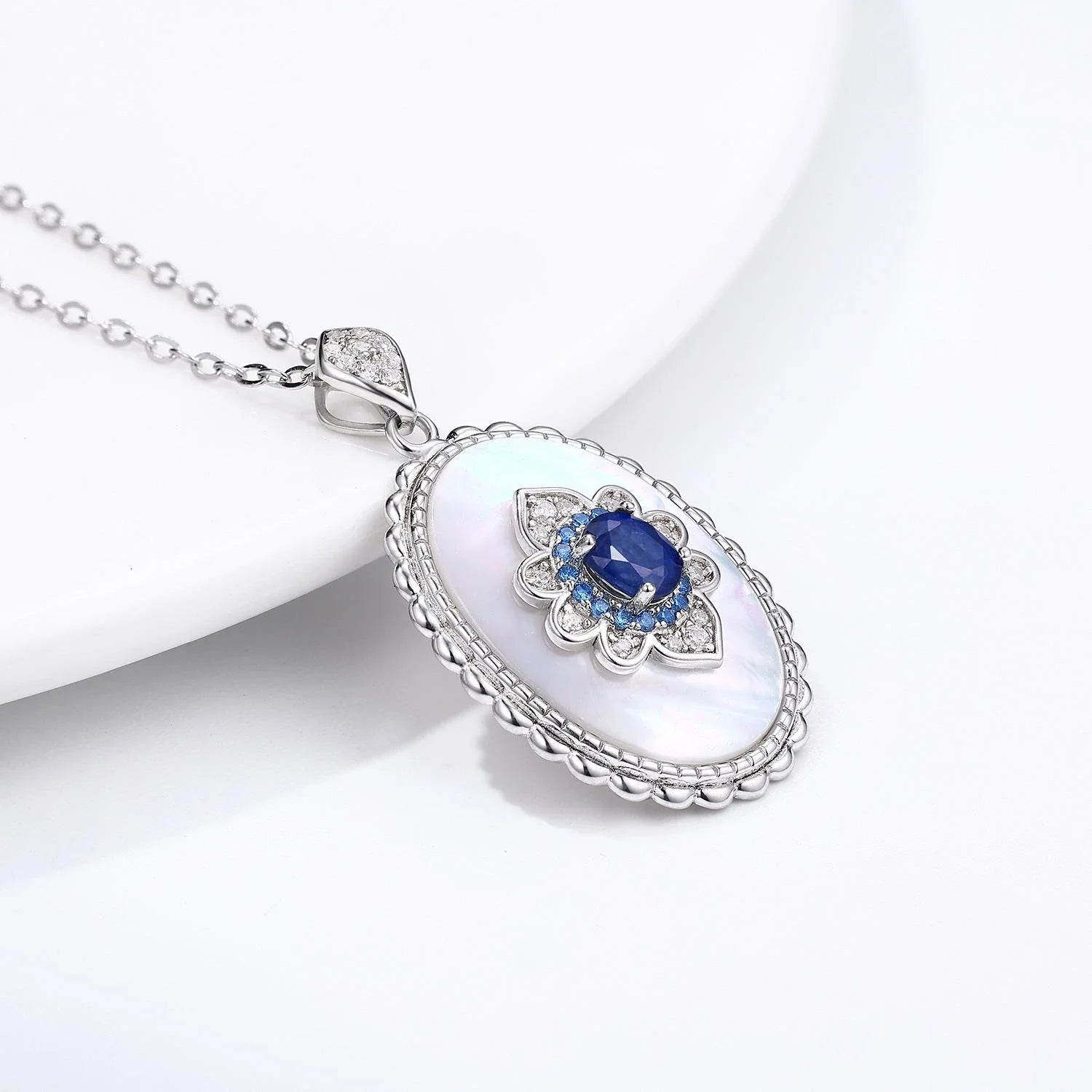 Elegant sterling silver pendant necklace with sparkling sapphires and diamonds, perfect for fashion-forward women