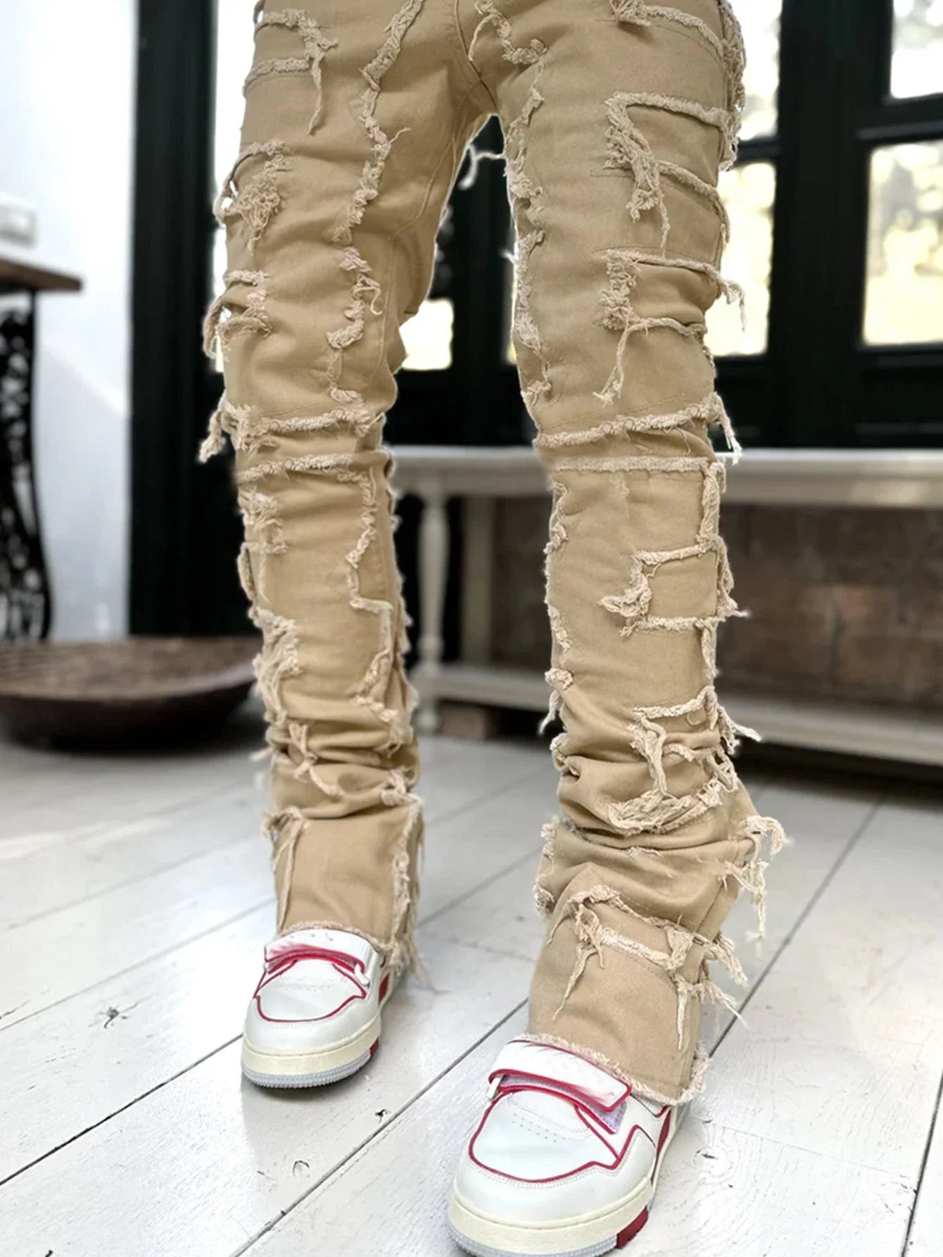 Stylish patched jeans with tight fit and stacked leg design in a variety of fashionable colors