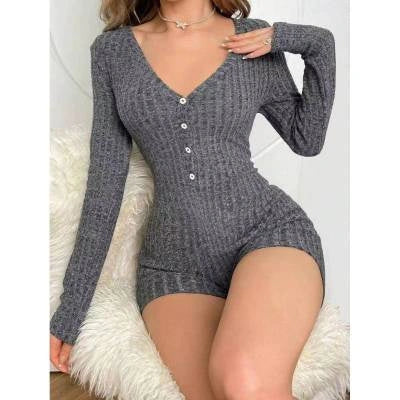 Elegant rib-knit jumpsuit in various colours, featuring a relaxed waistline and tapered legs for a sleek, flattering silhouette