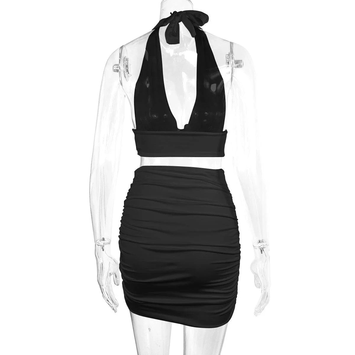 A stylish two-piece dress set featuring a halter-style lace-up top and a pleated hip-covering skirt, available in white, black, and pea green colors.
