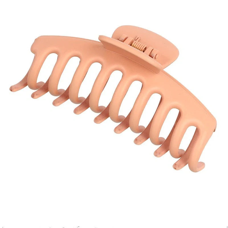 Candy-coloured plastic ponytail clip for showers and daily hair styling
