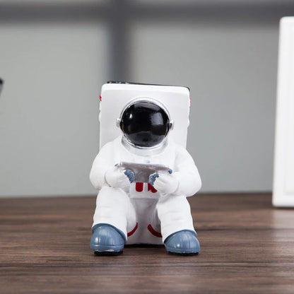 Charming astronaut-themed mobile phone stand made of high-quality resin, designed to securely hold your phone on your desk or workspace