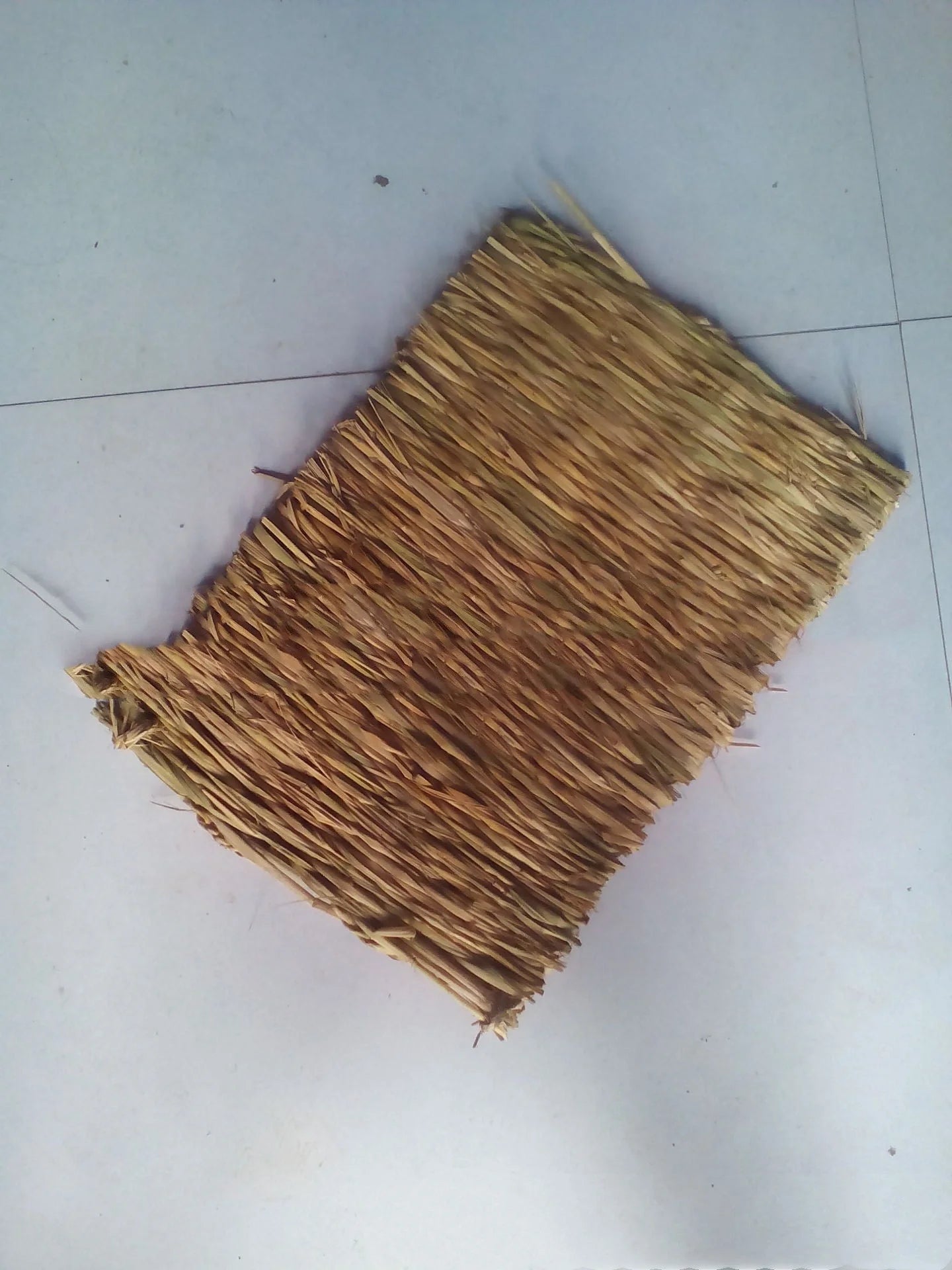 Premium handwoven straw mat for pets, featuring a textured surface and durable construction for comfort and functionality.