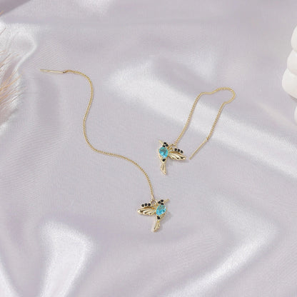 Elegant hummingbird drop earrings with crystal accents, a versatile fashion accessory for British women