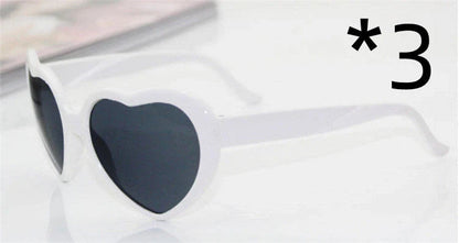 Stylish heart-shaped sunglasses with unique lens design that transforms light into enchanting special effects