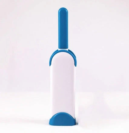 A reusable pet hair remover comb with a self-cleaning base, perfect for removing fur and lint from sofas, chairs, and other upholstery.