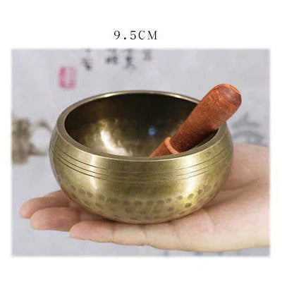 A handcrafted Tibetan singing bowl made of copper, used for meditation and relaxation.