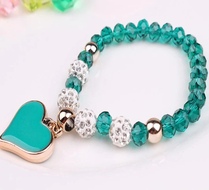 Elegant crystal heart-shaped bracelets in various vibrant colours, perfect for adding a touch of sophistication to any outfit