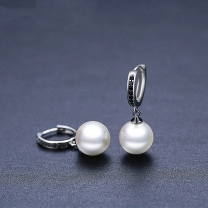 Trendy copper ball stud earrings with a minimalist design, showcasing a sleek and modern accessory for fashion-forward women