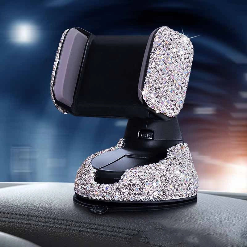 Diamond-encrusted car phone holder mounted on air vent with phone securely in place