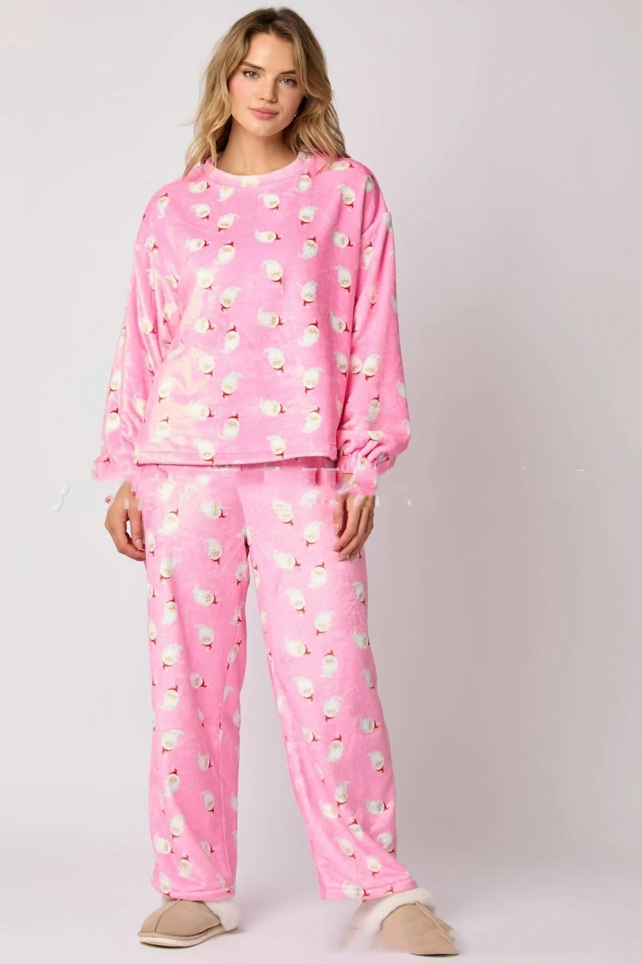 Women's festive flannel pajama set with Santa Claus design and long sleeves