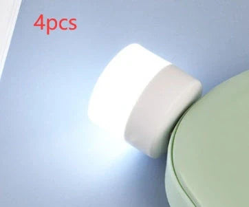 Compact USB LED night light with soft glow for reading and sleep