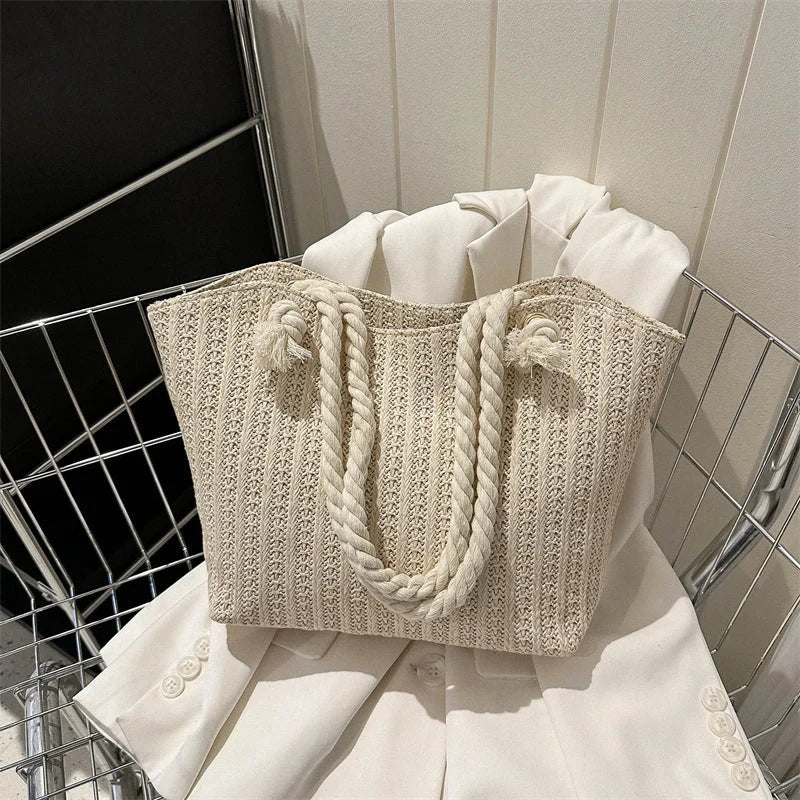 Stylish women's straw shoulder tote bag with large capacity, perfect for summer and everyday use.