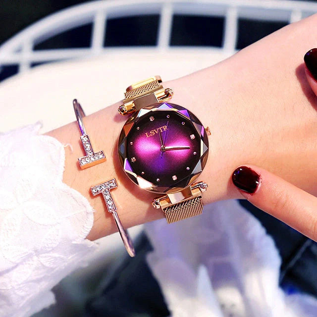 Elegant rose gold ladies' watch with diamond accents on a magnet strap