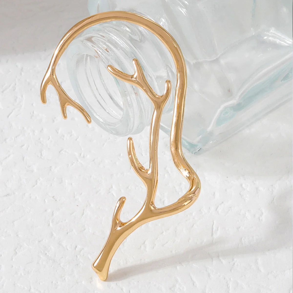 Vintage bone hypoallergenic elf earrings with geometric design in gold, silver, black, and green