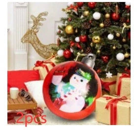 Vibrant inflatable Christmas baubles in a variety of colours and patterns, perfect for outdoor holiday decoration