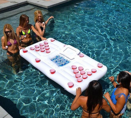 Inflatable beer pong table with built-in cooler floating in pool