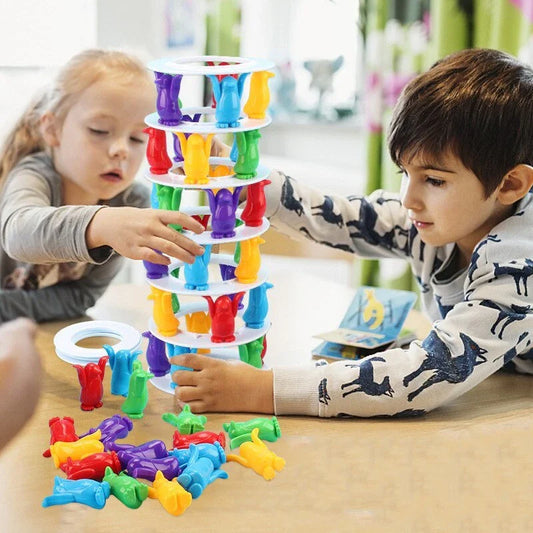 Stackable penguin-themed balance game with colourful plastic pieces for building challenging towers