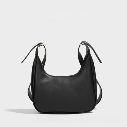 Stylish women's PU leather dumpling crossbody bag in black and white
