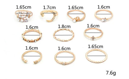 A set of 10 adjustable gold-plated rings with celestial-inspired designs including moons, stars, and pearls