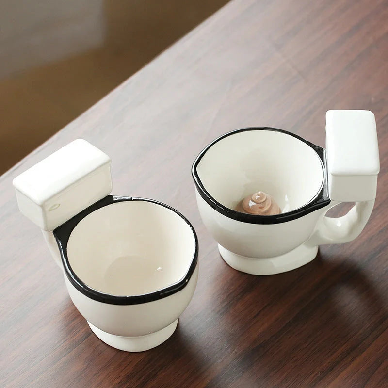 Toilet-shaped ceramic mug with handgrip, perfect for coffee or tea, holding 280ml.