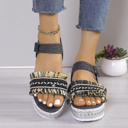 Stylish denim tassel sandals for women with thick flat sole, perfect for summer.
