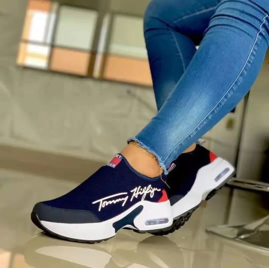 Women's Air Cushion Slip-on Sneakers in white, red, black, and navy blue