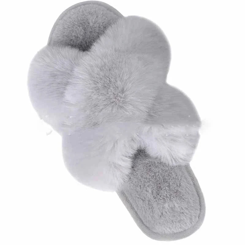 Cosy faux fur slippers in a variety of classic British colours, featuring a stylish cross-over design for indoor comfort and sophistication.