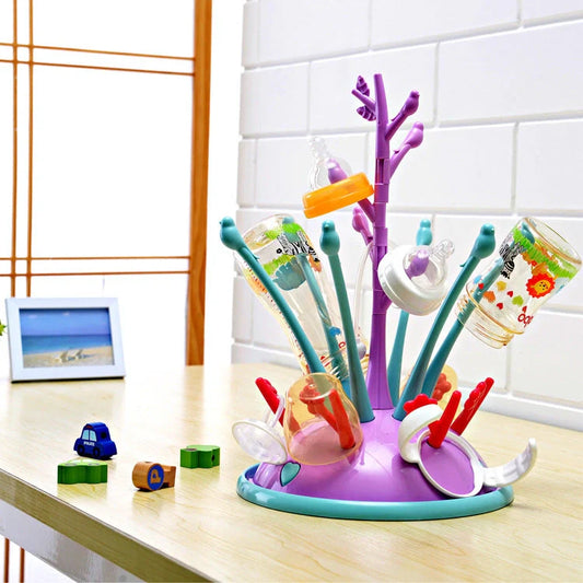 Portable baby bottle drying rack in green and purple, made from safe PP material