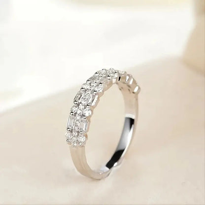 Elegant multilayer ring with a subtle geometric design, available in platinum, gold, and rose gold colours