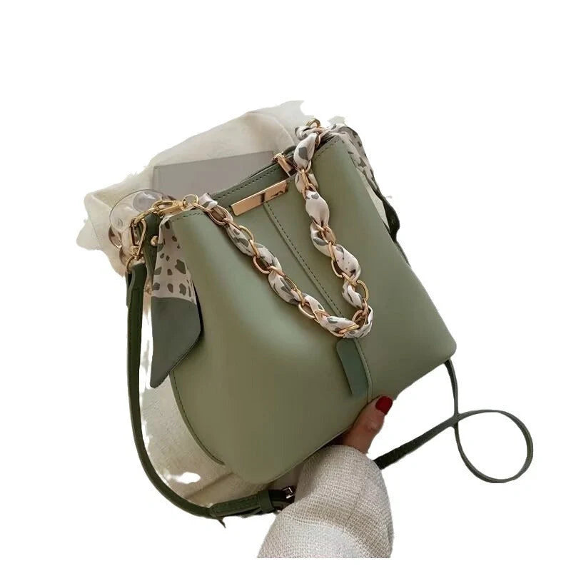 Women's PU bucket bag in white, army green, and light brown with adjustable shoulder strap