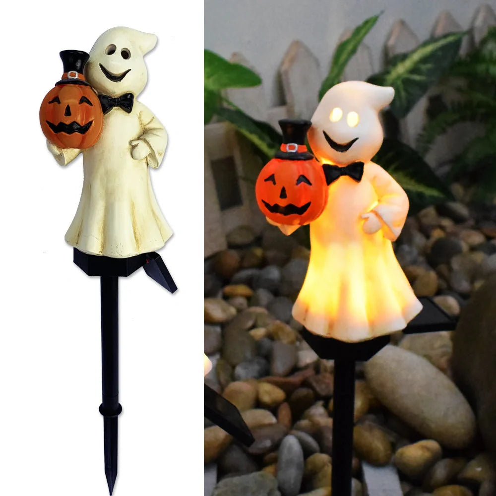 Solar-powered Halloween pumpkin lanterns in garden setting