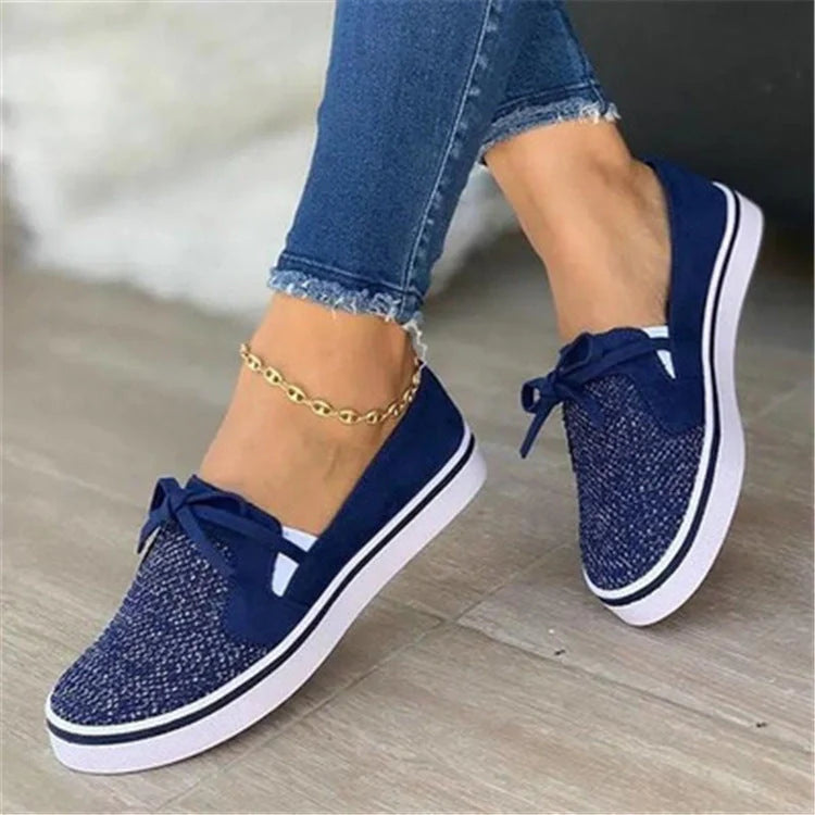 Women's white lace-up canvas flat shoes with cross straps