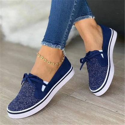 Women's white lace-up canvas flat shoes with cross straps