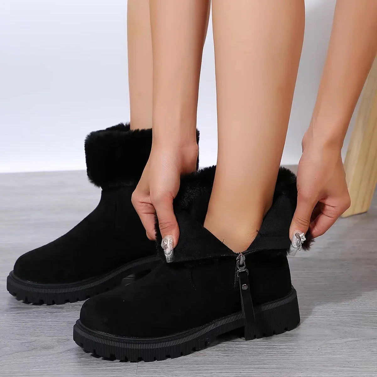 Cosy winter boots with plush lining, side zipper, and rubber soles for women in beige and black colours
