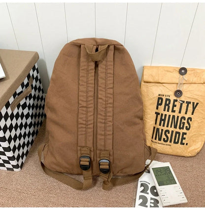 A stylish and durable canvas backpack with geometric patterns, designed for female college students