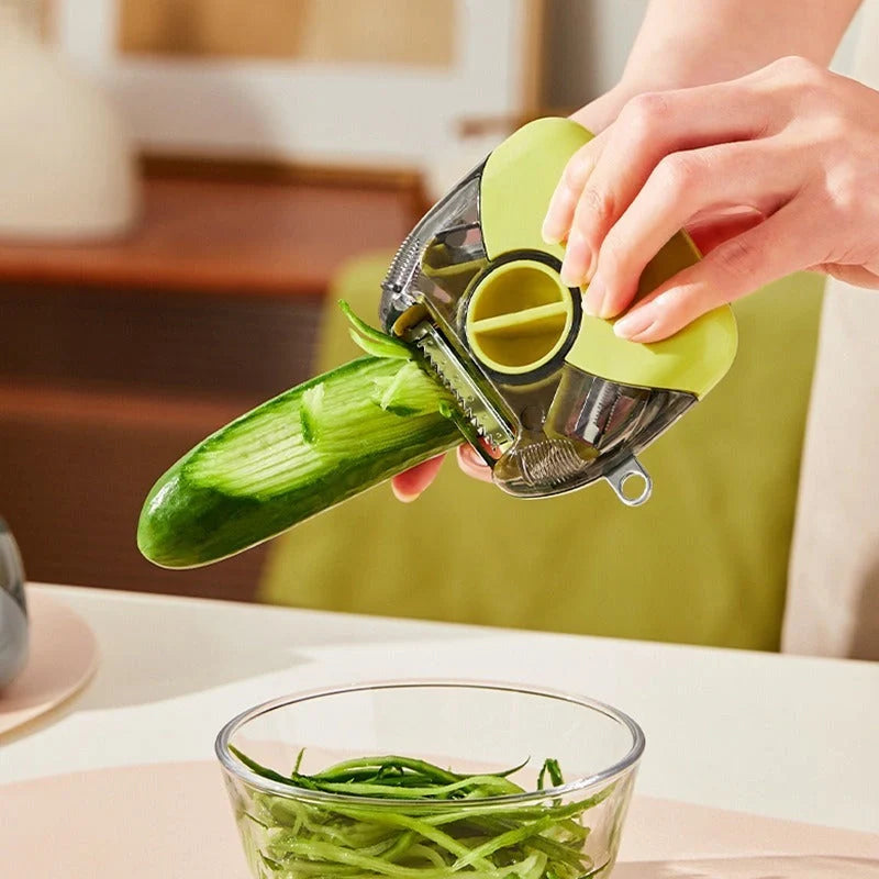 3-in-1 Stainless Steel Peeler Shredder in green and grey with ergonomic handle
