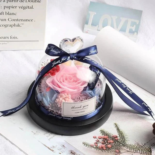 Enchanting Eternal Rose with LED lighting in a glass display, showcasing its timeless beauty and elegant design