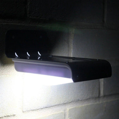 Solar-powered motion-activated outdoor light with bright LED illumination, weatherproof design, and automatic sensor activation