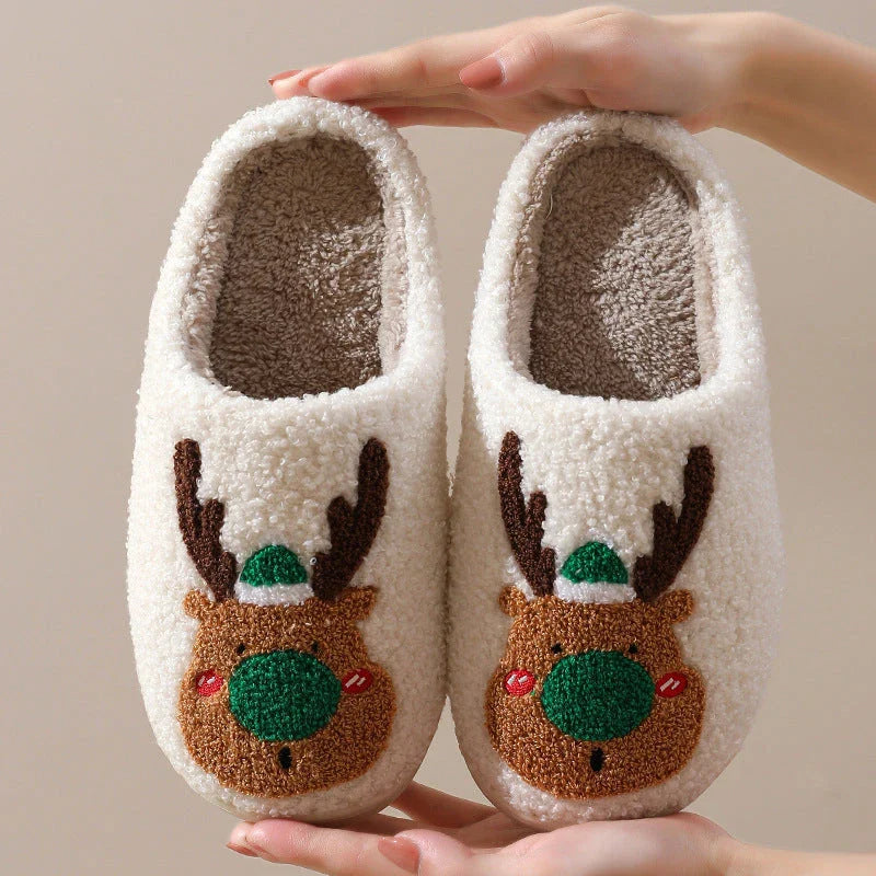 Cozy elk-themed slip-on house slippers in festive red and green colors with plush, soft materials for comfortable holiday relaxation
