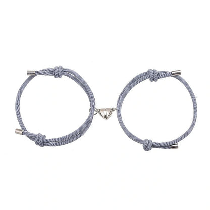 Adjustable nylon love magnetic bracelet with sticky metal heads in various colours