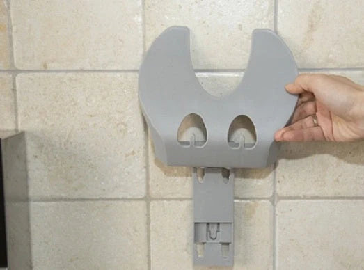 Wall-mounted kitchen organiser with double-layer storage and hooks for utensils
