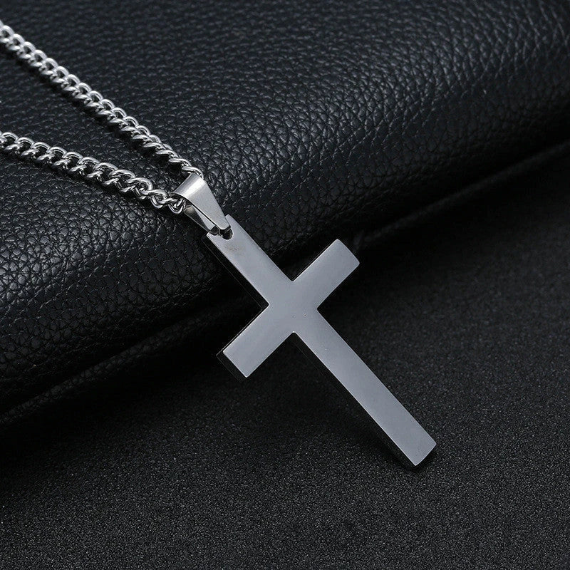 Stainless steel cross pendant necklace in black, silver, and gold colours, showcasing a classic and elegant design
